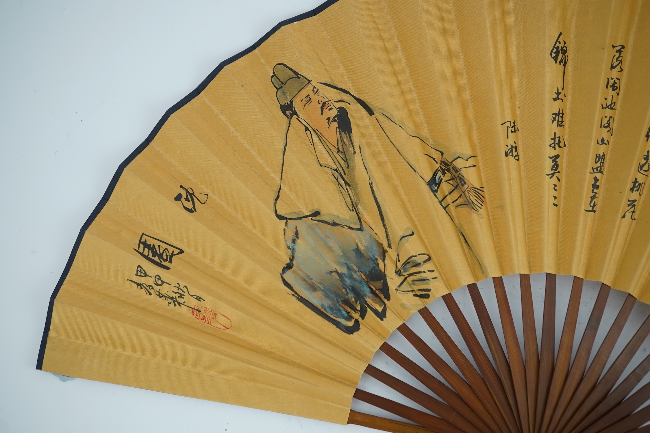 A fine Chinese sandalwood brise fan with finely carved sticks and guards, together with a mid 20th century silk calligraphic poetry LuYou fan, brise fan 38cm wide. Condition - minute damage to carving on one stick, sanda